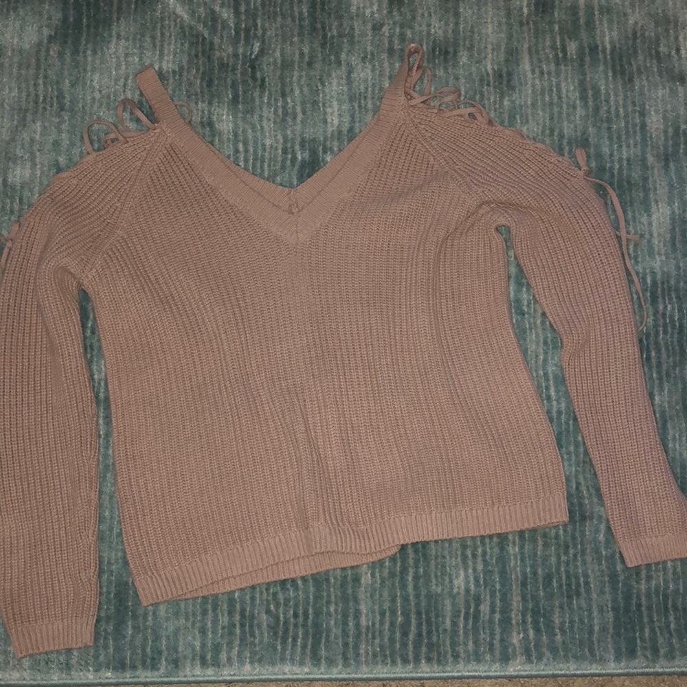 V-neck sweater with laced up open shoulders